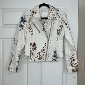 Blank NYC white biker jacket with floral embroidery. Vegan Leather.